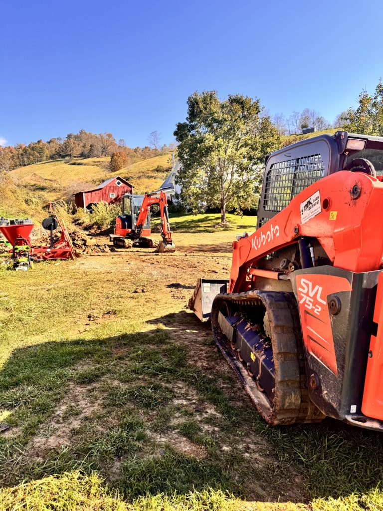 Tractors at work pulling away debris