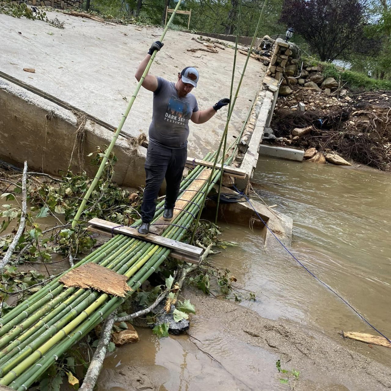 Volunteer Trevor making a temporary bridge